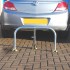 Galvanised Fold Down Hoop Barrier & Integral Lock (in front of a vehicle).